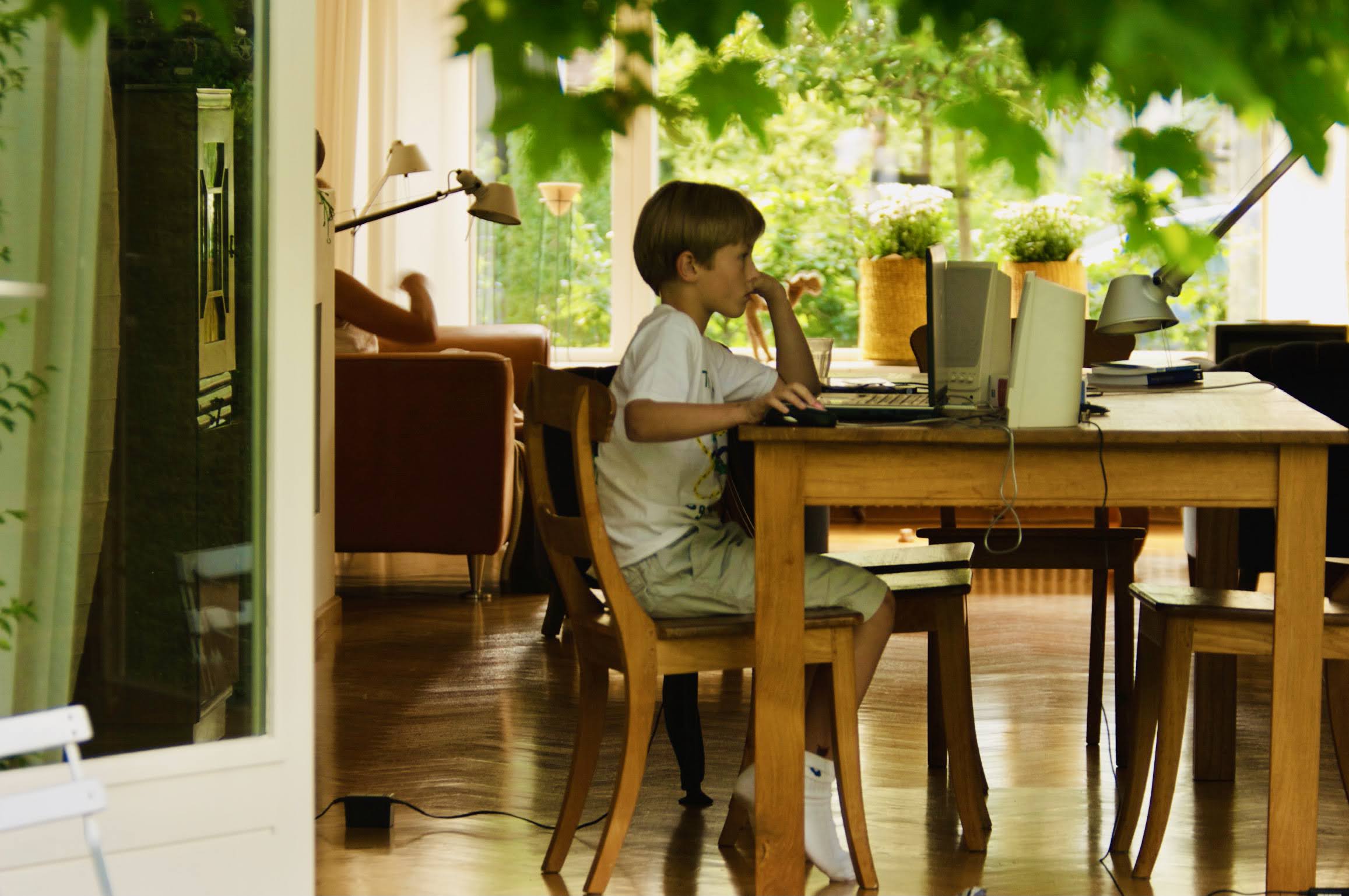 Victor as a child at his computer